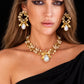 Model wearing handmade gold-plated brass pearl bow earrings and necklace set