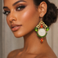 One-of-a-kind handmade statement earrings featuring authentic Pahlavi-era coins, sparkling red and green crystals, and intricate vintage-inspired detailing. A unique collector’s piece by Baharnaz Gallery. Only one pair available.