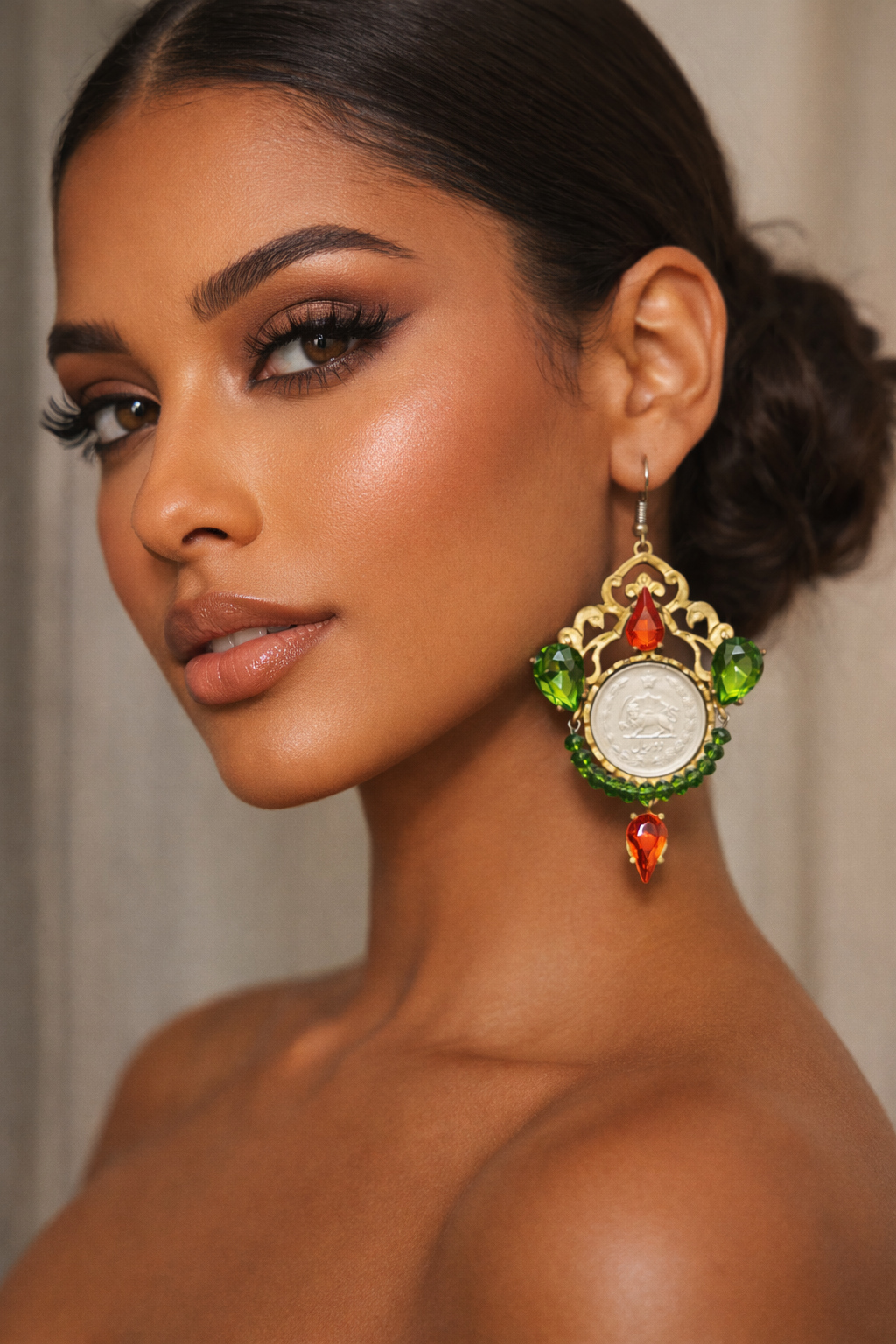 One-of-a-kind handmade statement earrings featuring authentic Pahlavi-era coins, sparkling red and green crystals, and intricate vintage-inspired detailing. A unique collector’s piece by Baharnaz Gallery. Only one pair available.