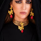 Model wearing handmade gold leaf butterfly earrings and choker necklace with red coral stone drops